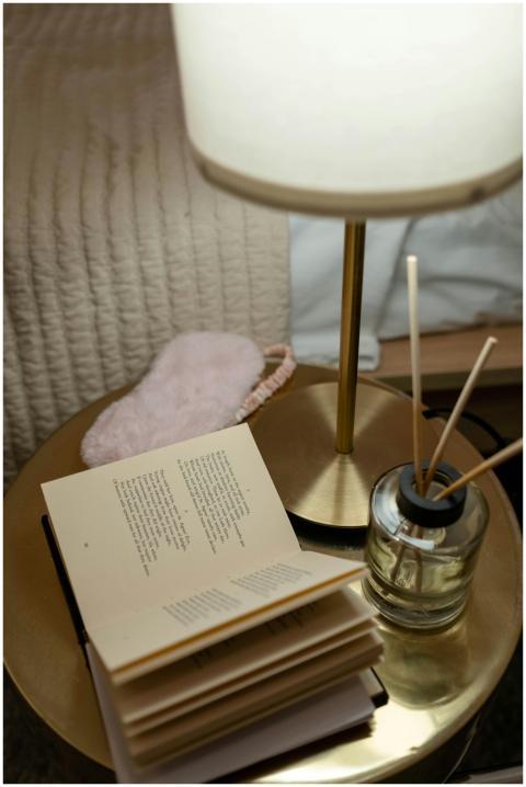 Inviting bedroom scene featuring a bedside table w