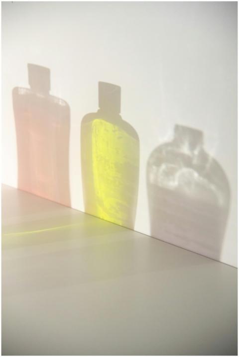 Creative composition of colorful bottle shadows ca