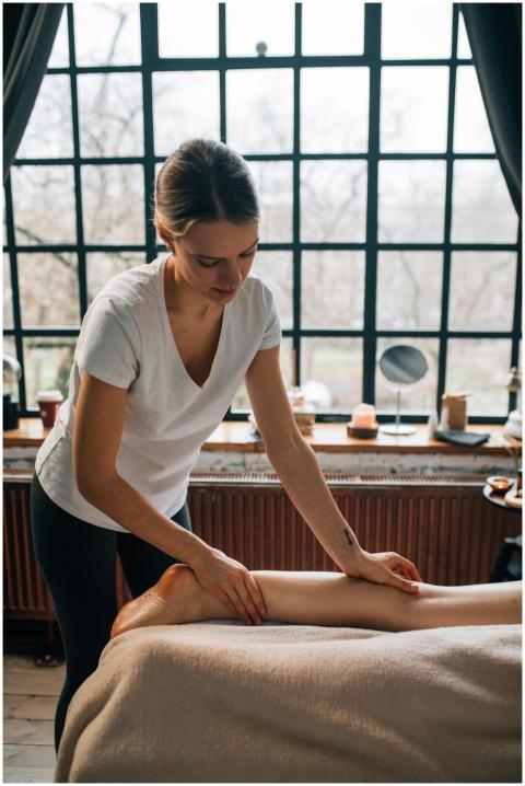 A woman provides a calming foot massage in a tranq