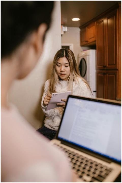 Young woman engaged in online learning at home wit