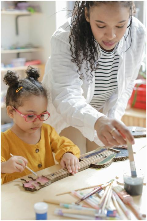 A mother and daughter enjoying a hands-on painting