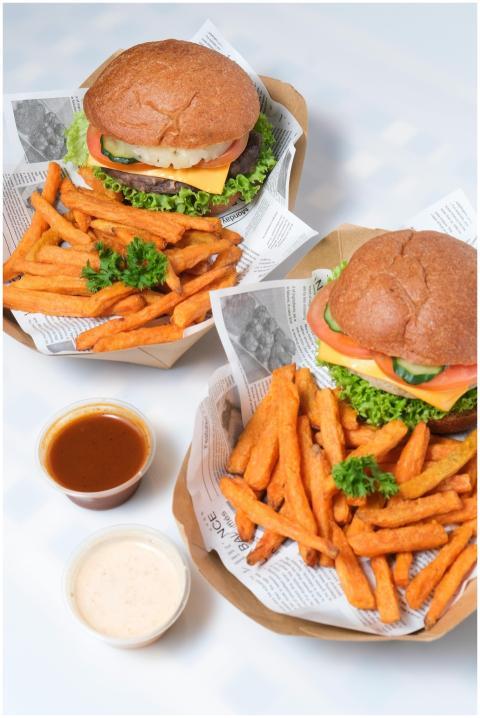 A delightful meal of burgers with vegetables and g