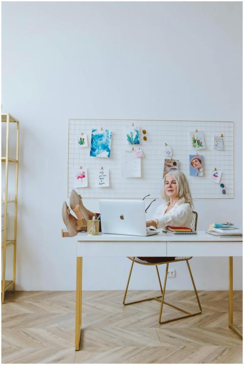Elderly woman with grey hair relaxing at home offi