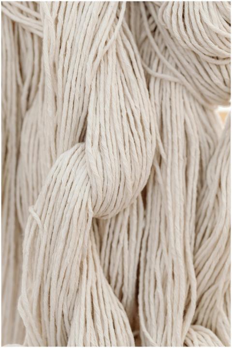High-quality close-up of white cotton yarn, showca