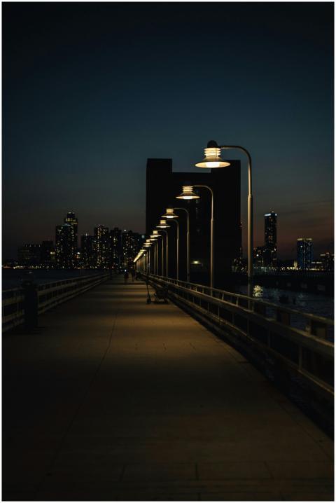 A serene nighttime view of a city with an illumina