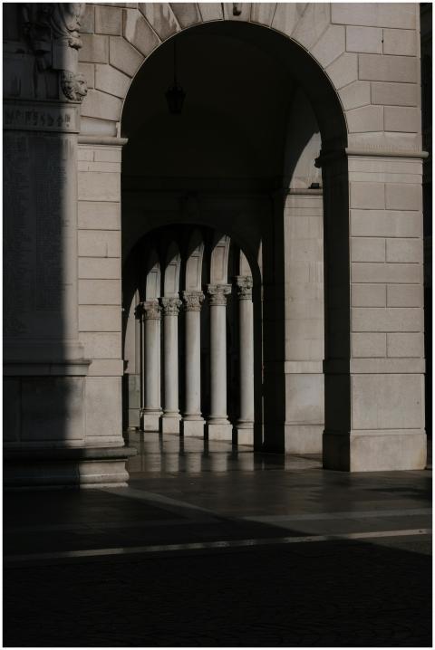 Sunlight casting shadows in a classical architectu