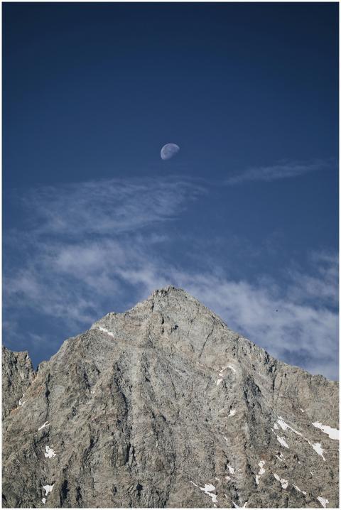 Stunning mountain peak with a visible moon, captur