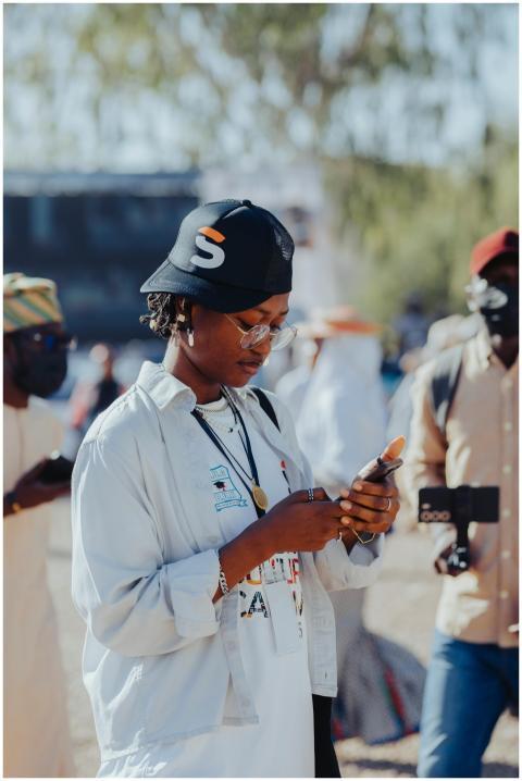 A vibrant street scene during a carnival in Kano,