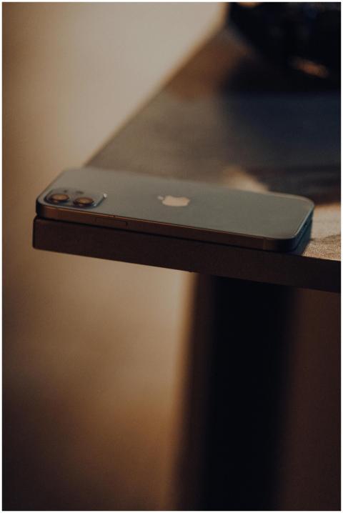 Close-up of a modern smartphone placed on the edge