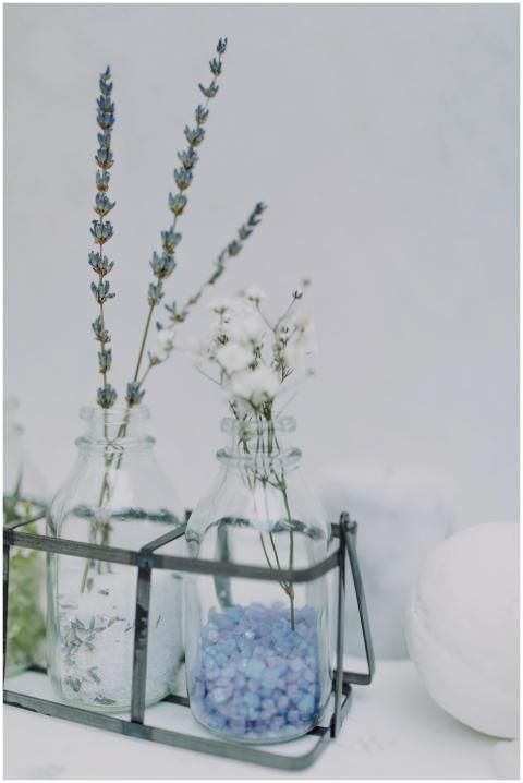 Elegant glass bottles with lavender flowers and bl