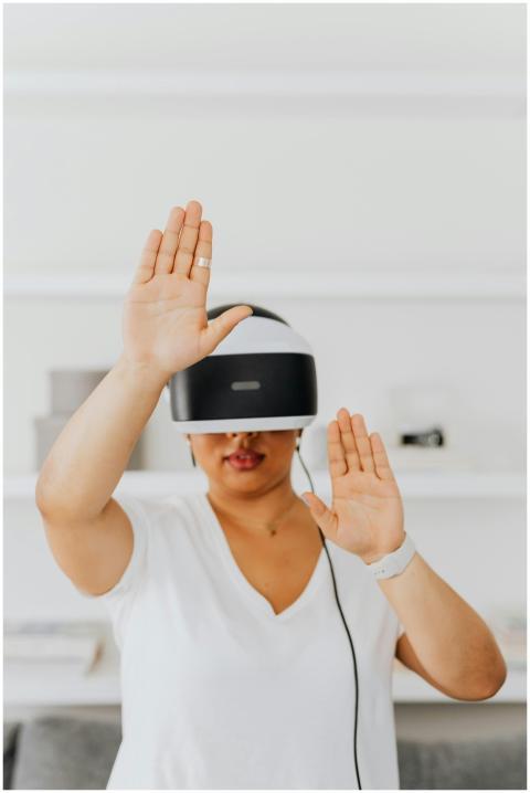 Adult woman wearing a VR headset and interacting w