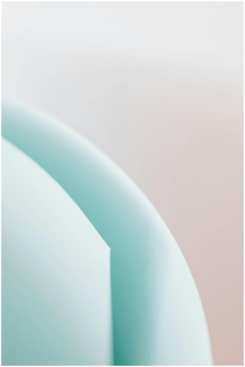 Macro colorful paper rolled with blurred gradient