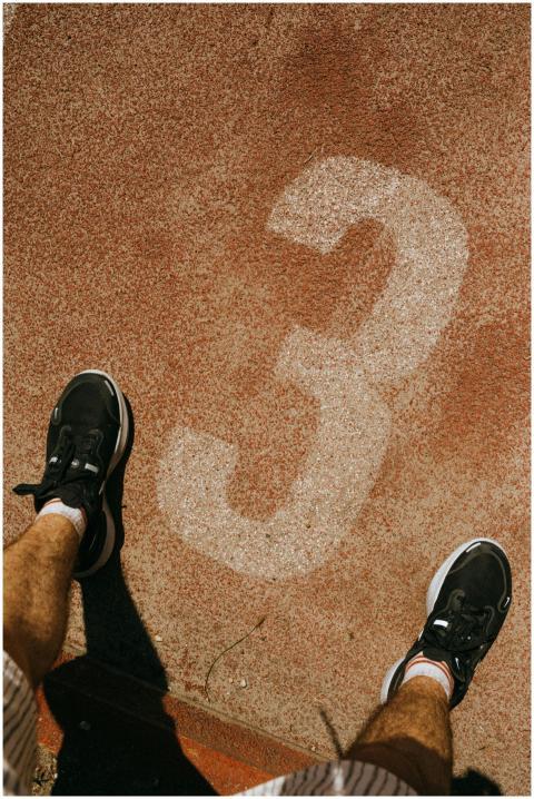 Top view of a person standing on lane three of an