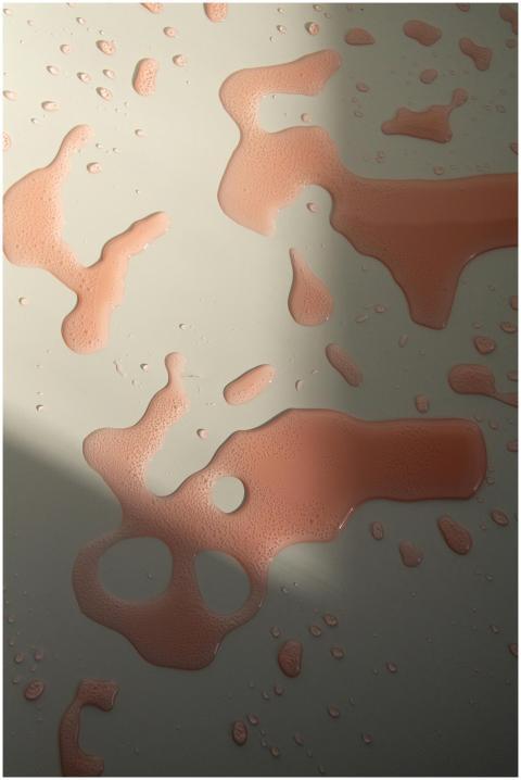 Light plays on water droplets creating abstract pa