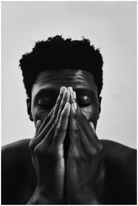 Black and white portrait capturing a man in a cont