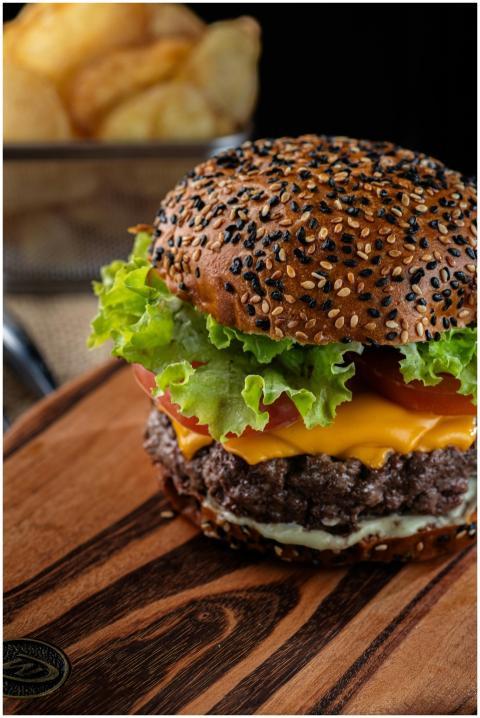 Close-up of a delicious cheeseburger with fresh le