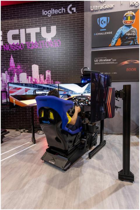 Person enjoying a high-tech racing simulator at a