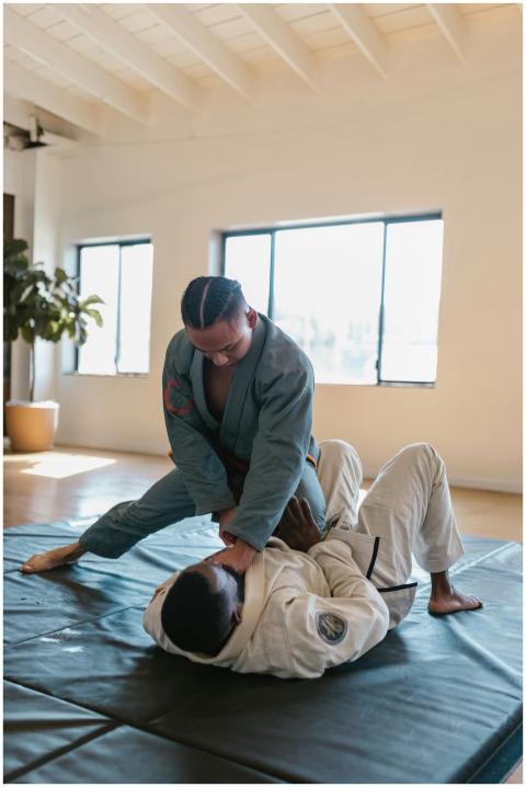 Two individuals practicing Brazilian Jiu-Jitsu in
