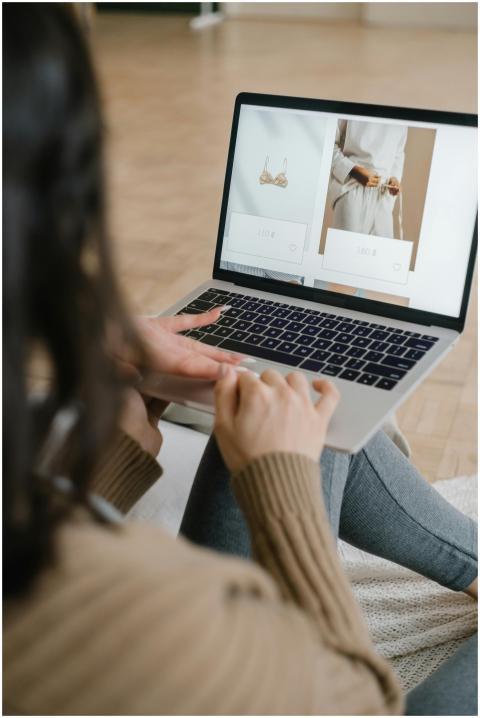 Female browsing an online fashion store on a lapto