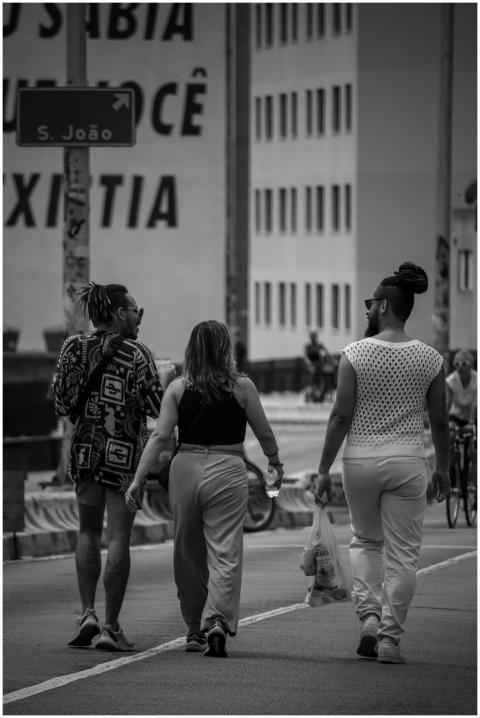 Group of people walking in a city street, captured