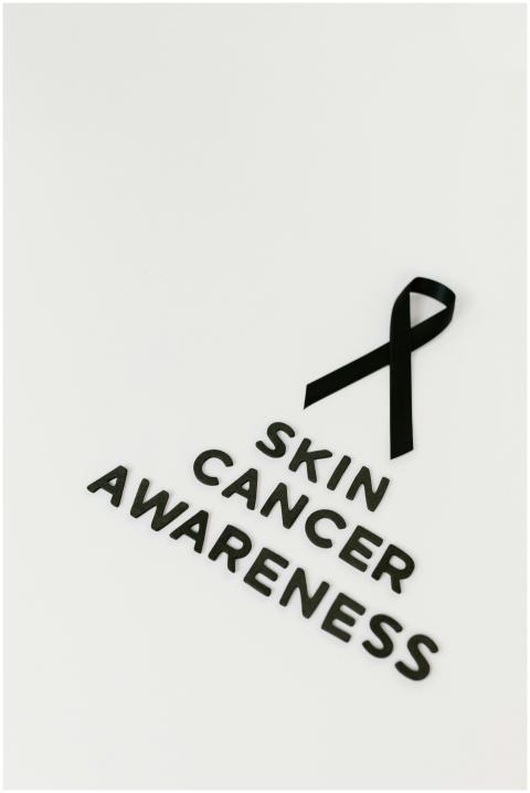 Black ribbon symbolizing skin cancer awareness on