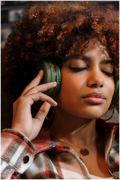 Portrait of a woman with curly hair relaxing with