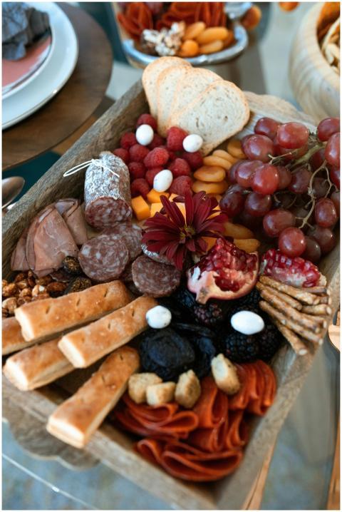 A vibrant charcuterie board featuring assorted mea