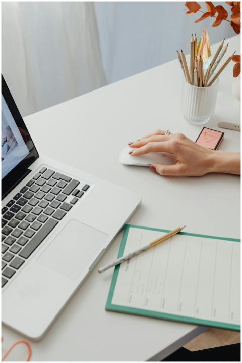 Modern workspace featuring a laptop, planner, and