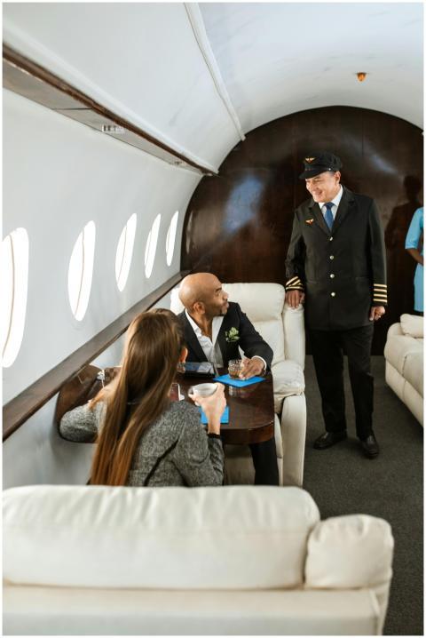 Executives conversing with pilot in luxury private