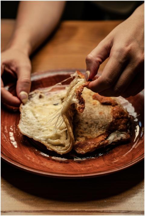 A close-up of hands preparing a traditional Mexica