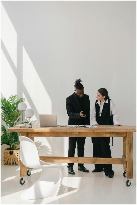 Two professionals engaged in discussion at a sleek