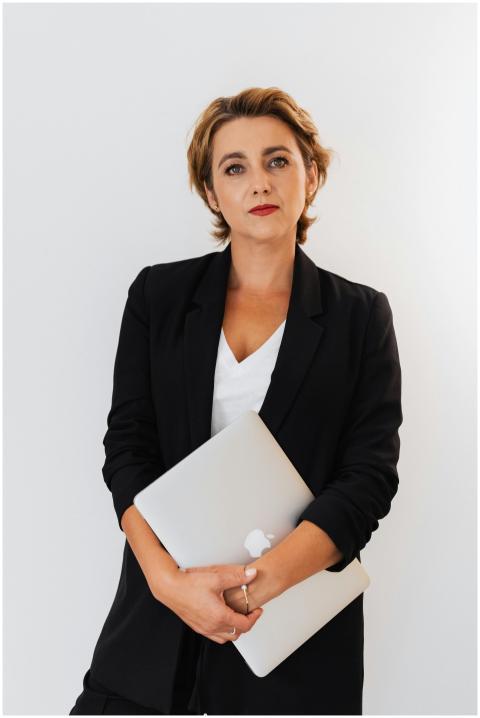 Portrait of a poised businesswoman in a black blaz