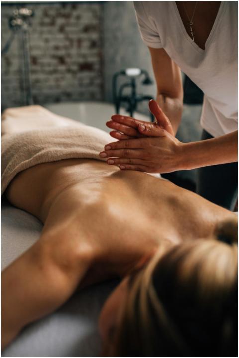 Relaxing indoor massage session with a masseuse pr