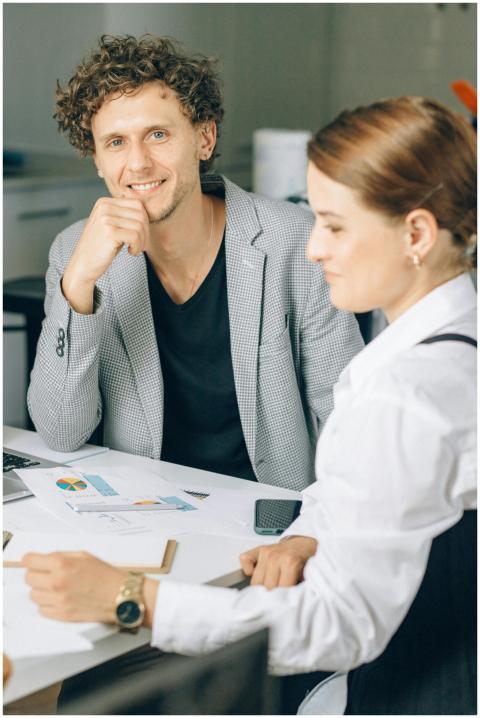 Two colleagues engaged in a business meeting in a