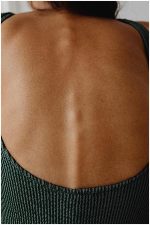 Detailed view of a person's back, highlighting tex