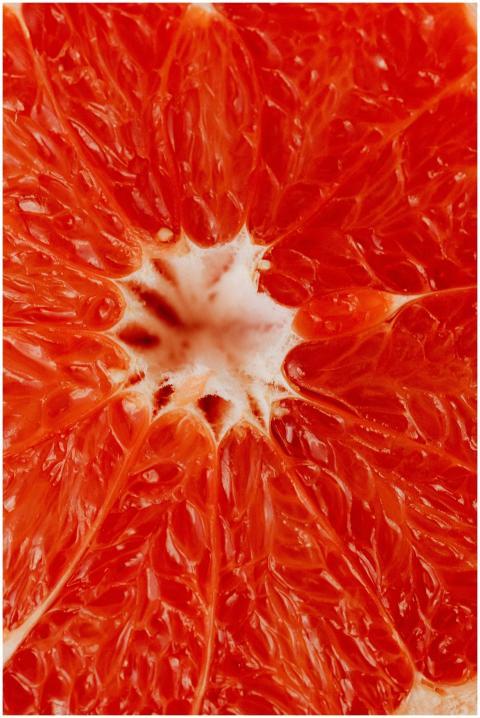 Detailed macro shot of a vibrant grapefruit with v