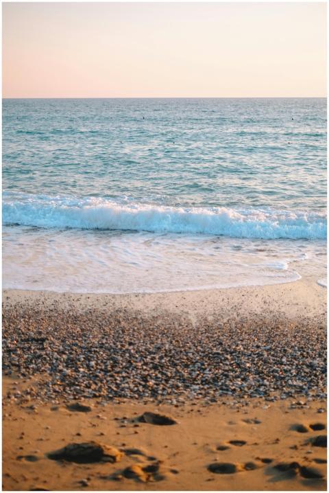 Peaceful beach scene with gentle waves and a warm