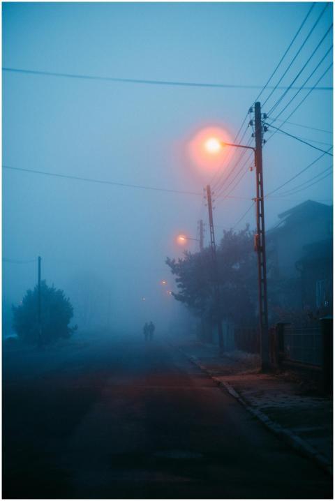A mysterious evening scene with silhouettes walkin