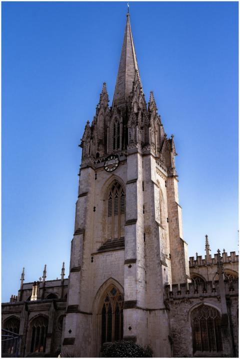 Gothic church with striking steeple against a clea