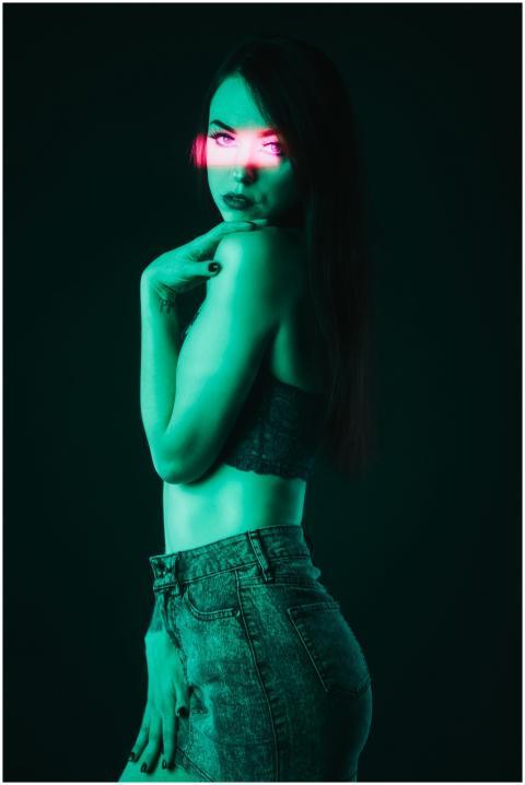 Artistic portrait of a young woman with neon light