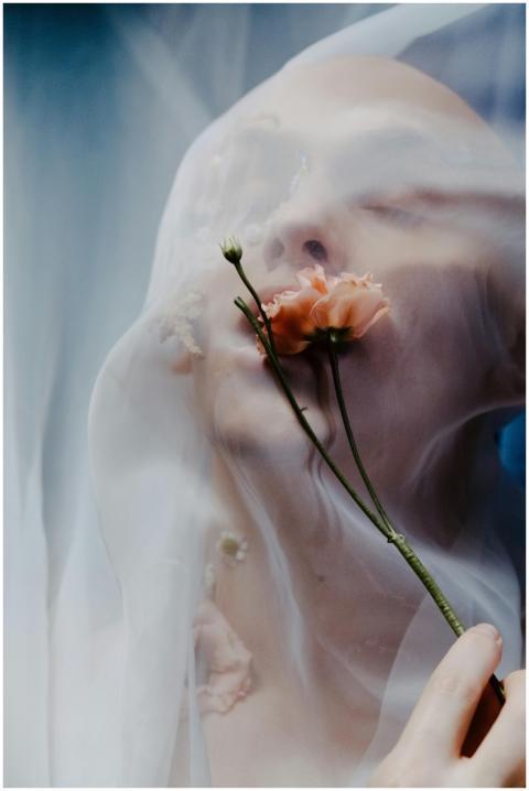 Ethereal portrait of a person with a transparent v