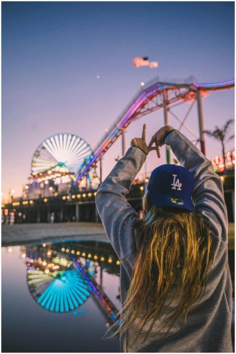 Back view of a woman enjoying Santa Monica Pier am