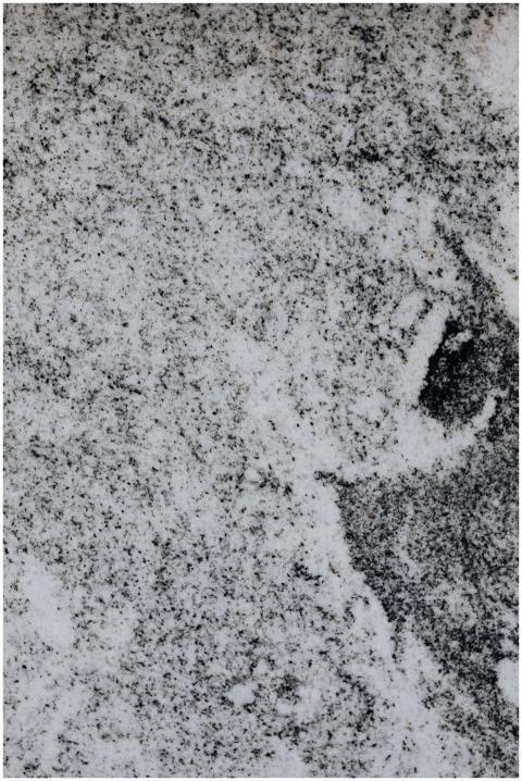 A detailed close-up view of a white marble surface