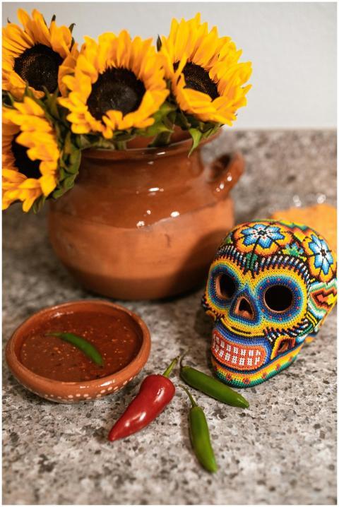 Colorful Mexican beaded skull and sunflowers on ru