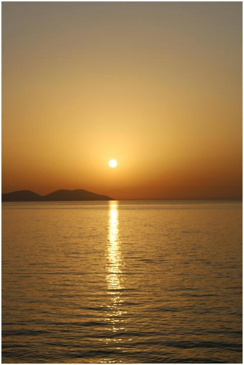 Tranquil sunset view over the ocean with a golden