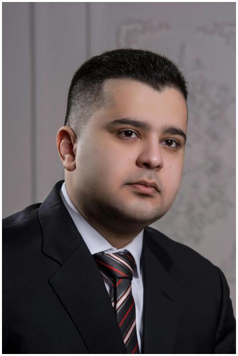 Business portrait of a young man in a suit with a