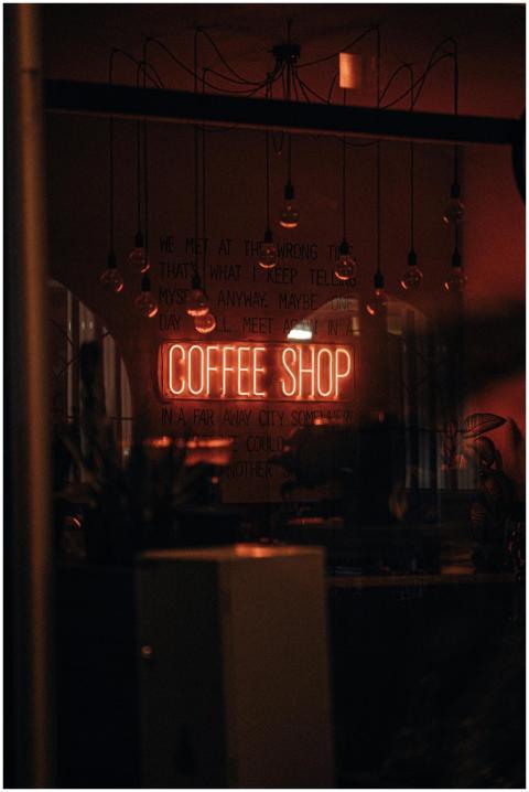 Warm and inviting coffee shop with neon signage, c