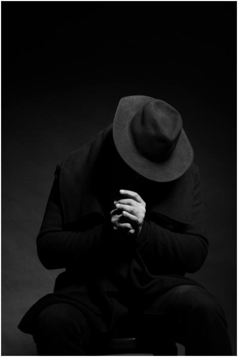 Moody black and white photo of an anonymous person