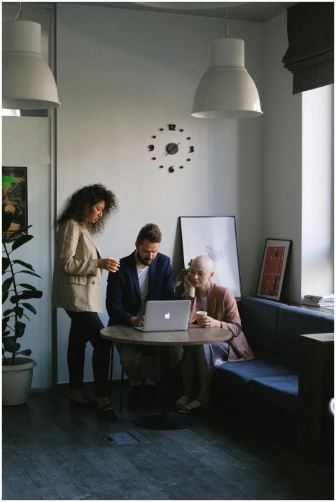 Diverse team engaged in a meeting, discussing stra
