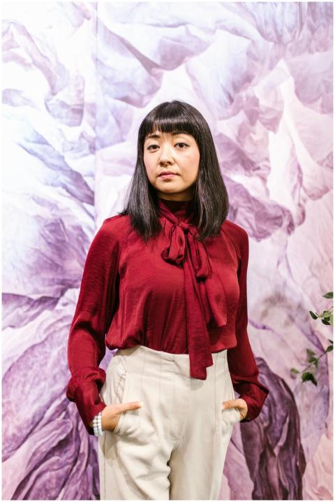 Portrait of a businesswoman in stylish burgundy to